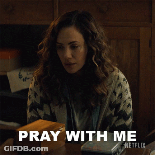 A Woman Sitting At A Table With The Words Pray With Me Netflix GIF