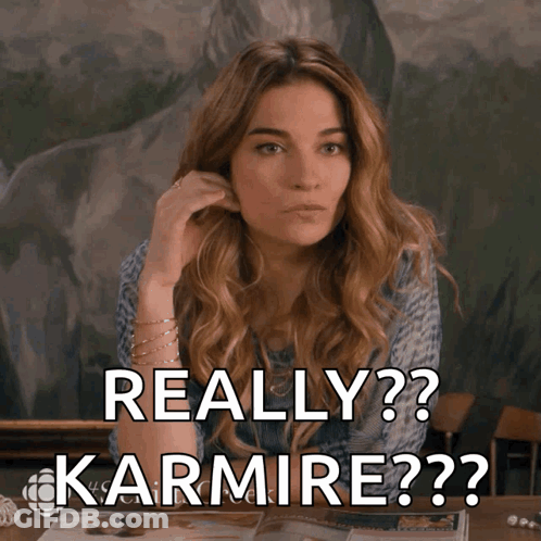A Woman Sitting At A Table With The Words Really Karmire On The Screen GIF