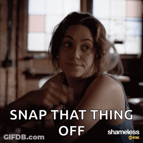 A Woman Sitting At A Table With The Words Snap That Thing Off Above Her GIF