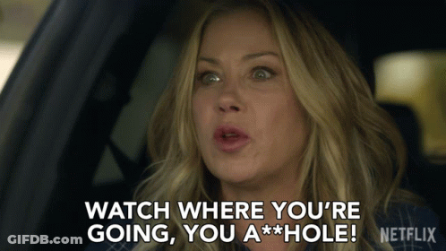 A Woman Sitting In A Car Says " Watch Where You 'Re Going You A Hole " GIF