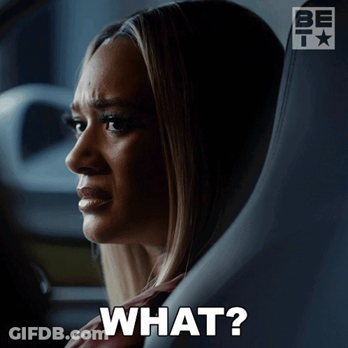 A Woman Sitting In A Car With A Question Mark That Says What GIF