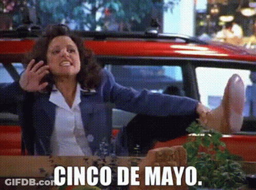A Woman Sitting In A Car With Her Feet Up And The Words Cinco De Mayo GIF
