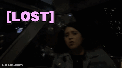 A Woman Sitting In A Car With The Word Lost Written Above Her GIF
