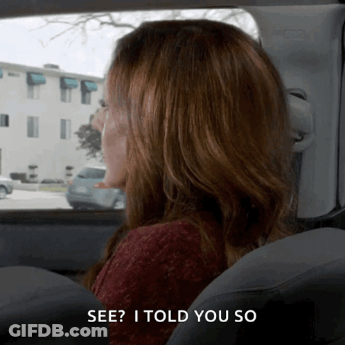 A Woman Sitting In A Car With The Words See I Told You So Below Her GIF