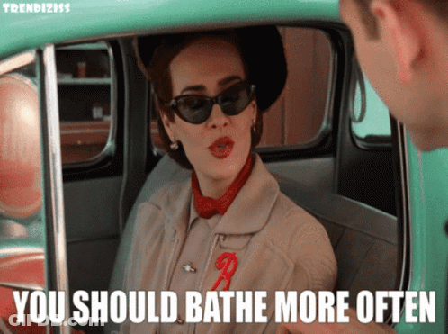A Woman Sitting In A Car With The Words You Should Bathe More Often GIF