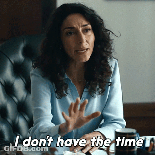A Woman Sitting In A Chair Says " I Don 'T Have The Time " GIF
