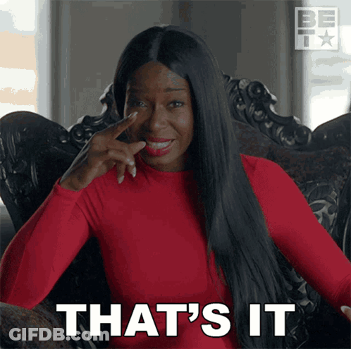A Woman Sitting In A Chair With Her Finger On Her Nose And The Words That 'S It GIF