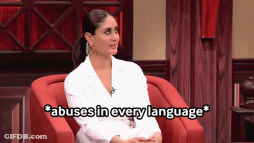A Woman Sitting In A Chair With The Words Abuses In Every Language Written Below Her GIF
