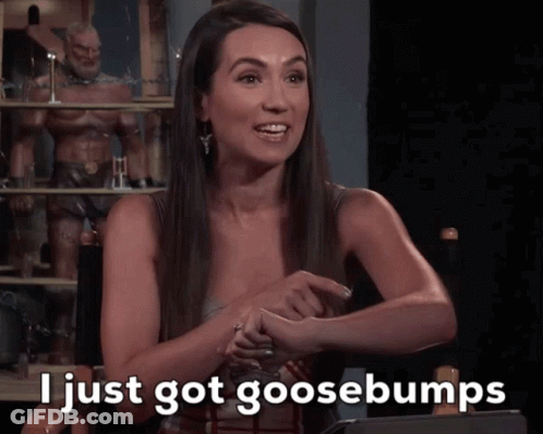 A Woman Sitting In A Chair With The Words I Just Got Goosebumps On The Screen GIF