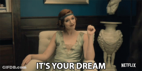 A Woman Sitting In A Chair With The Words " It 'S Your Dream " Written On The Screen GIF