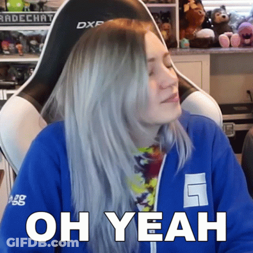 A Woman Sitting In A Chair With The Words Oh Yeah On Her Face GIF