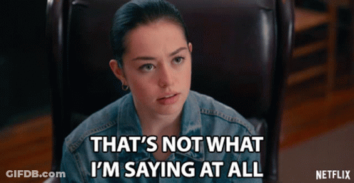 A Woman Sitting In A Chair With The Words That 'S Not What I 'M Saying At All GIF