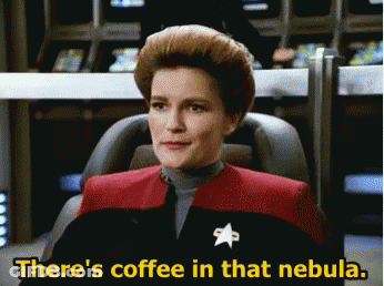 A Woman Sitting In A Chair With The Words There 'S Coffee In That Nebula Below Her GIF