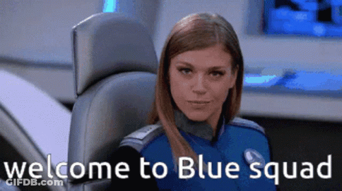 A Woman Sitting In A Chair With The Words Welcome To Blue Squad GIF