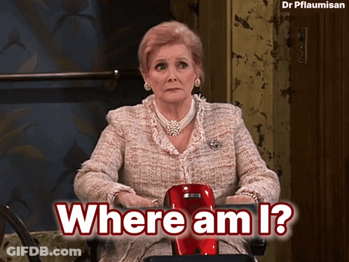 A Woman Sitting In A Chair With The Words Where Am I Written Above Her GIF