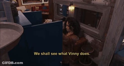 A Woman Sitting In A Room With The Words We Shall See What Vinny Does GIF