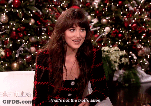 A Woman Sitting In Front Of A Christmas Tree Says That 'S Not The Truth Ellen GIF