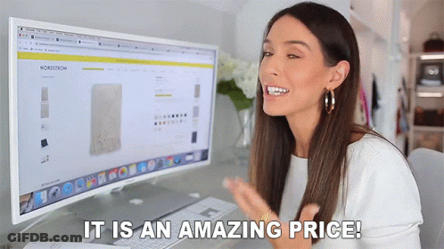 A Woman Sitting In Front Of A Computer With The Words " It Is An Amazing Price " GIF