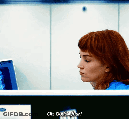 A Woman Sitting In Front Of A Computer With The Words Oh God A Four Written Below Her GIF