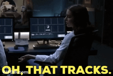 A Woman Sitting In Front Of A Computer With The Words Oh That Tracks On The Bottom GIF