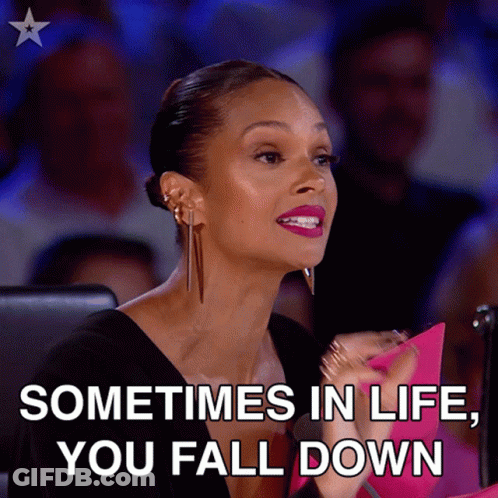 A Woman Sitting In Front Of A Crowd With The Words " Sometimes In Life You Fall Down " GIF