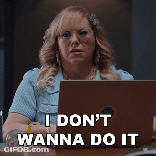 A Woman Sitting In Front Of A Laptop With The Words " I Don 'T Wanna Do It " GIF