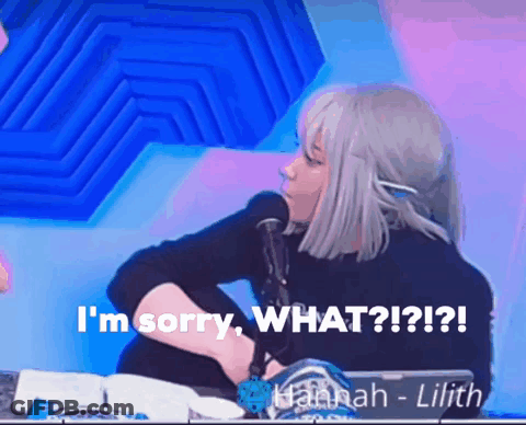 A Woman Sitting In Front Of A Microphone With The Words " I 'M Sorry What ? " GIF