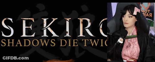 A Woman Sitting In Front Of A Microphone With The Words Sekiro Shadows Die Twice Written Above Her GIF