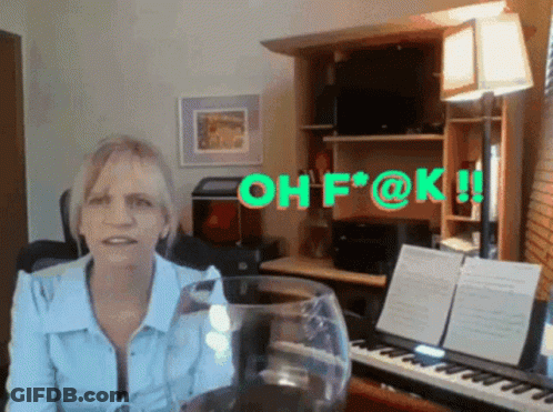 A Woman Sitting In Front Of A Piano With The Words Oh F @ K Written In Green Letters GIF