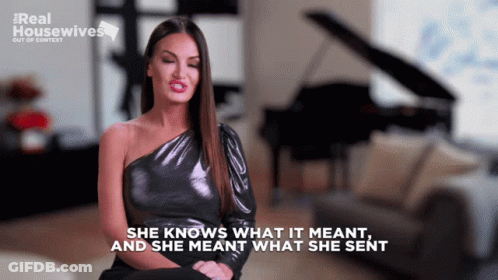 A Woman Sitting In Front Of A Piano With The Words She Knows What It Meant And She Meant What She Sent GIF