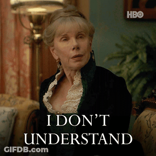 A Woman Sitting In Front Of A Sign That Says I Don 'T Understand On It GIF