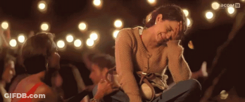 A Woman Sitting Next To Another Woman With The Word Pacom In The Upper Right Corner GIF