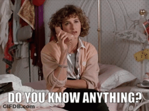A Woman Sitting On A Bed Talking On A Phone With The Words Do You Know Anything Written Below Her GIF
