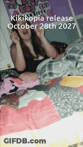Woman Sitting On Bed With October 28 2027 GIF