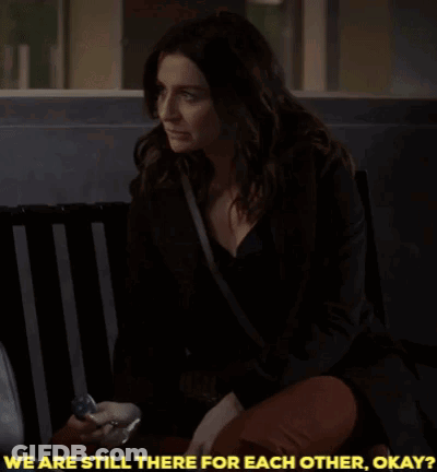 A Woman Sitting On A Bench With The Words " We Are Still There For Each Other Okay " GIF