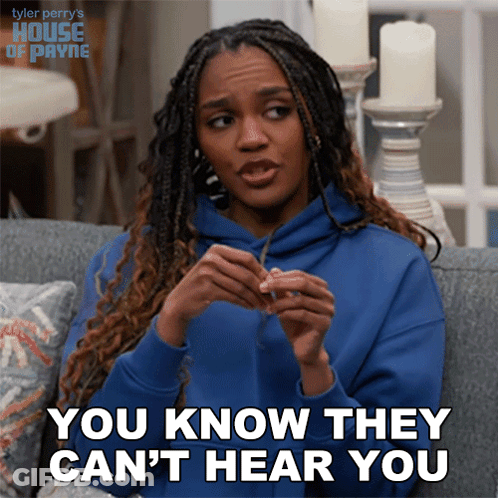 A Woman Sitting On A Couch Says You Know They Can T Hear You GIF