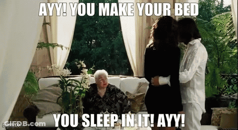 A Woman Sitting On A Couch With A Caption That Says Ayy You Make Your Bed You Sleep In It GIF