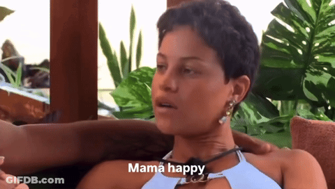 A Woman Sitting On A Couch With A Caption That Says Mama Happy GIF