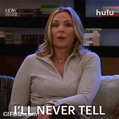 A Woman Sitting On A Couch With A Hulu Logo Behind Her GIF