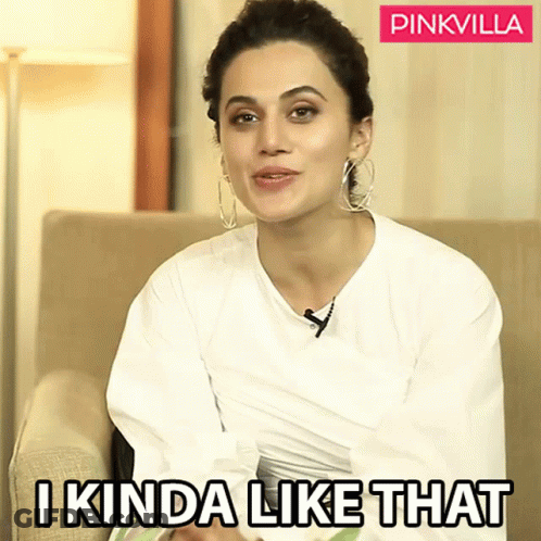 A Woman Sitting On A Couch With A Pinkvilla Logo Behind Her GIF