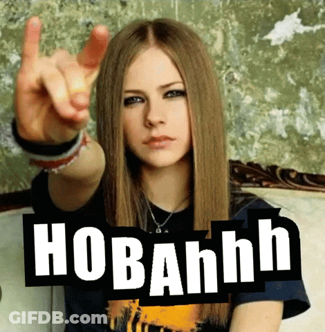 A Woman Sitting On A Couch With A Sign That Says Hobahnh On It GIF