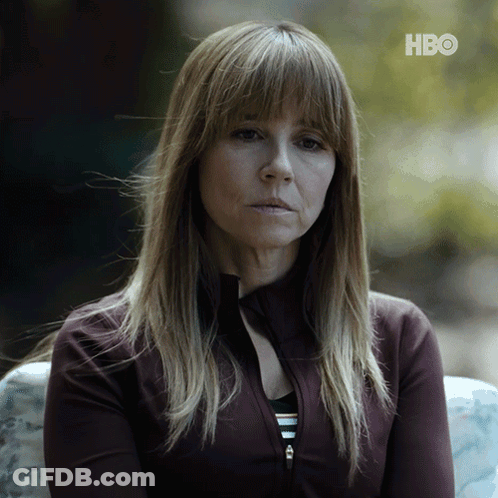 A Woman Sitting On A Couch With Hbo Written On The Bottom Right GIF