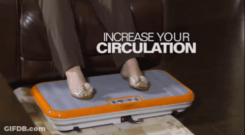 A Woman Sitting On A Couch With Her Feet On An Orange Device That Says Increase Your Circulation GIF