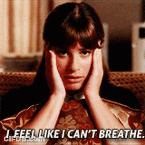 A Woman Sitting On A Couch With Her Hands On Her Face And The Words " I Feel Like I Can 'T Breathe " GIF