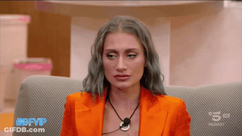 A Woman Sitting On A Couch With The Hashtag #Gfvip On The Screen GIF