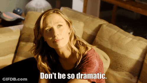 A Woman Sitting On A Couch With The Words " Don 'T Be So Dramatic " Written On The Bottom GIF
