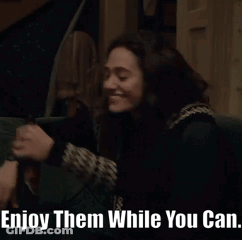 A Woman Sitting On A Couch With The Words Enjoy Them While You Can Written Below Her GIF