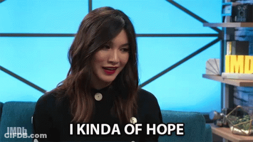A Woman Sitting On A Couch With The Words I Kinda Of Hope On Her Face GIF