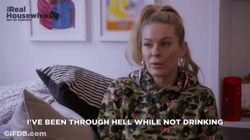 A Woman Sitting On A Couch With The Words I 'Ve Been Through Hell While Not Drinking GIF