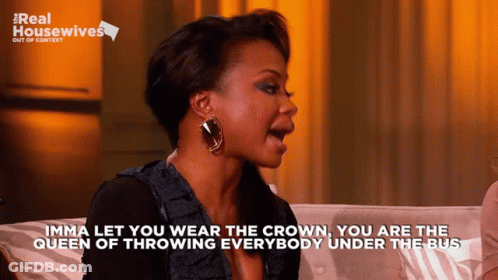 A Woman Sitting On A Couch With The Words " Imma Let You Wear The Crown " On The Bottom GIF